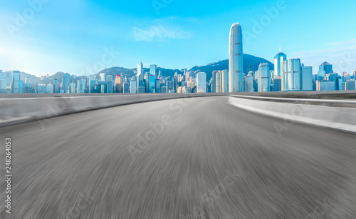 Road and skyline of modern urban architecture in Hong Kong..