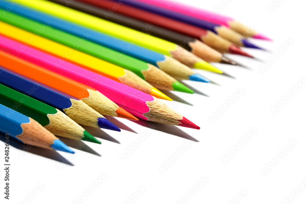 Multiple colored pencils on a white background. Multiple colored pencils on a white background.