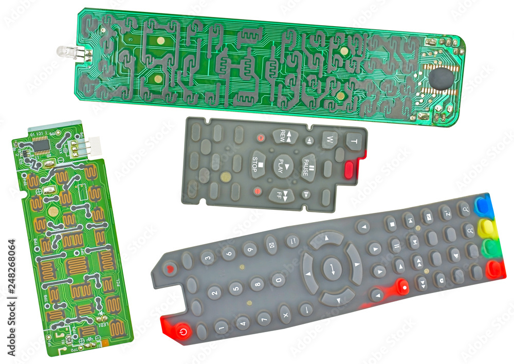 Parts of broken tv remote control on a white