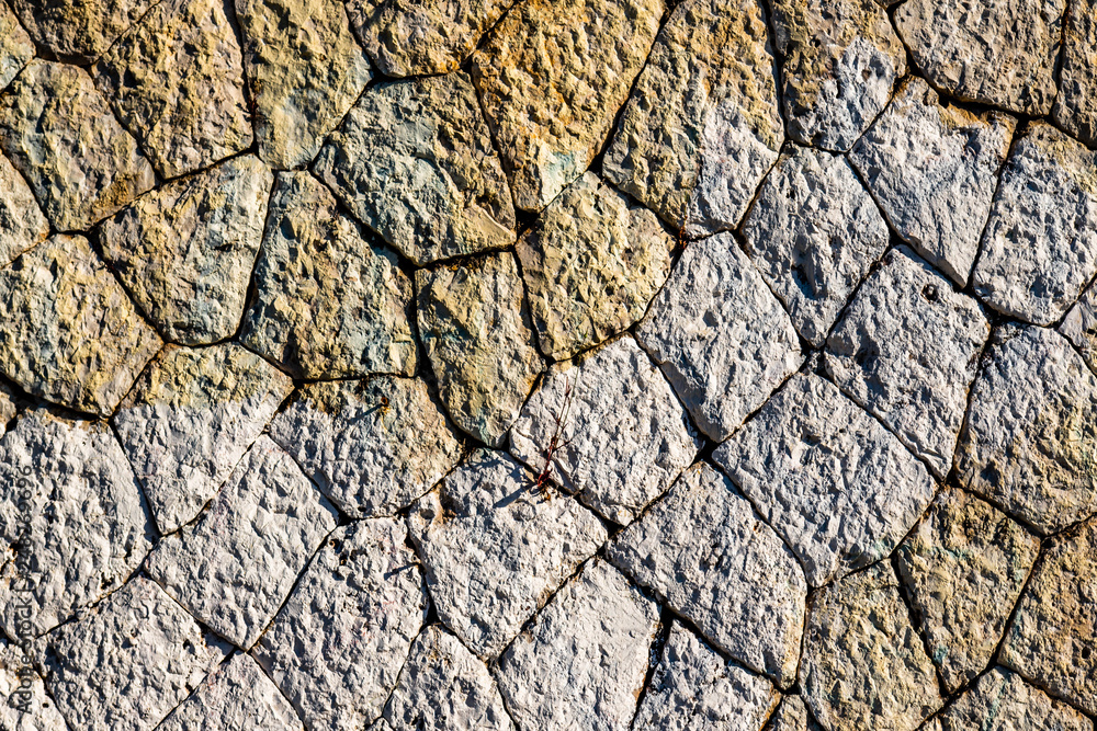Cobblestones pattern viewed from above as a full frame texture, background. Cobblestones pattern viewed from above as a full frame texture, background.