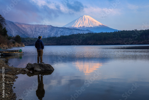Person viewing Mount Fuji and lake Saiko  photo