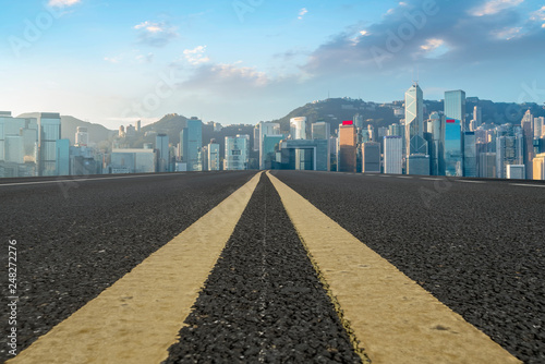 Road and skyline of modern urban architecture in Hong Kong.. #248272276