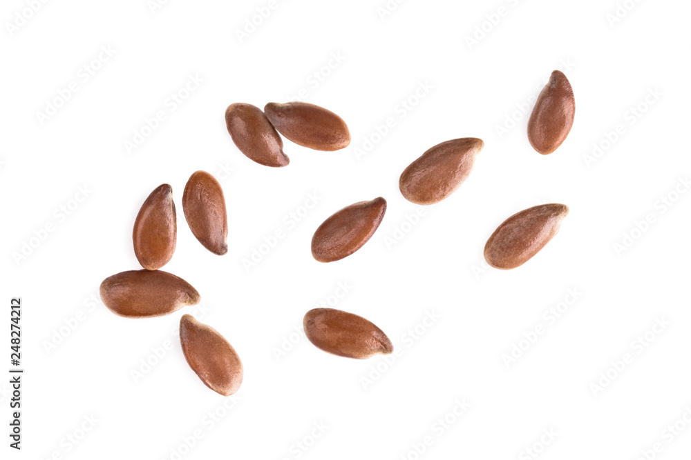 Small group of linseeds or flax seeds spread out and isolated on white background - obrazy, fototapety, plakaty 