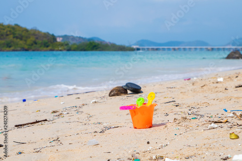 Dirty beaches.Caused by the dumping of undisciplined. Pollution on the beach of tropical sea. Environmental pollution. Children's toys on the dirt beach.