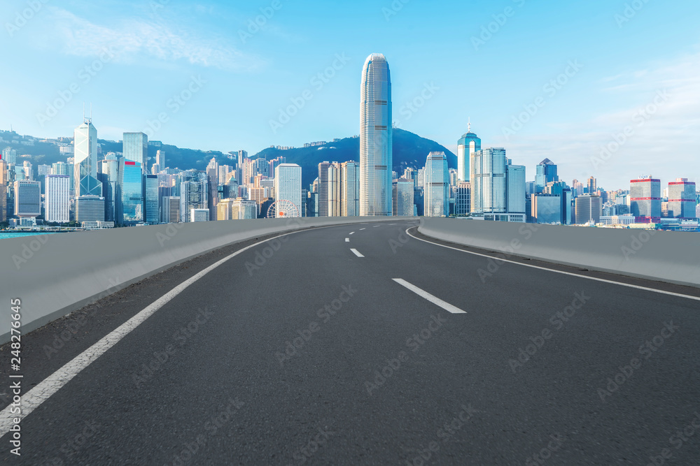 Road and skyline of modern urban architecture in Hong Kong..