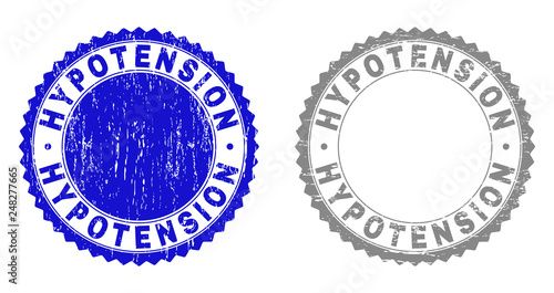 Grunge HYPOTENSION stamp seals isolated on a white background. Rosette seals with distress texture in blue and gray colors. Vector rubber stamp imitation of HYPOTENSION caption inside round rosette.