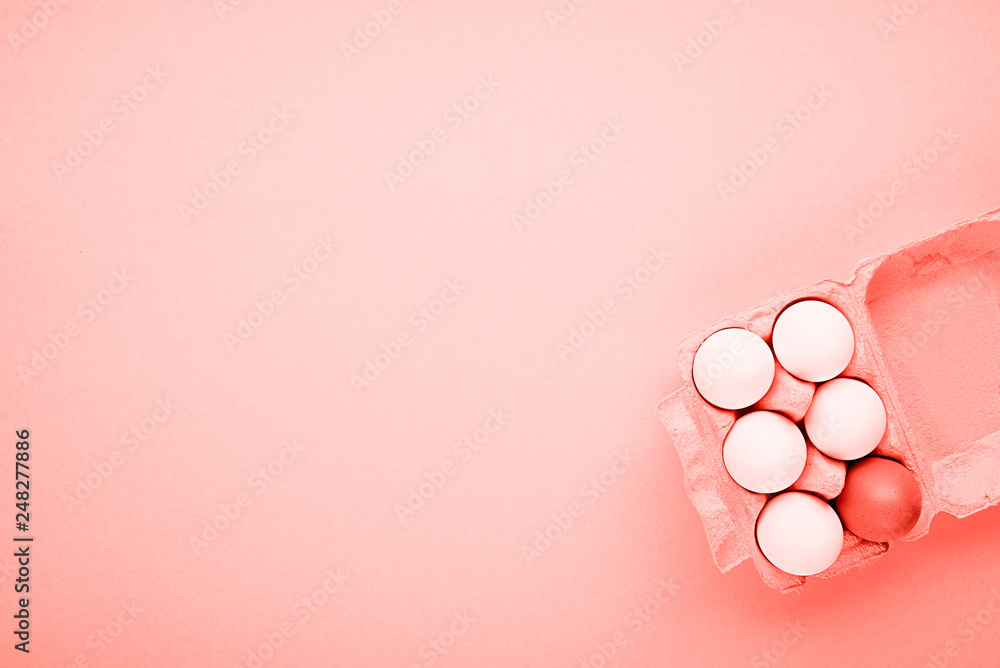 Eggs in a container. Creative Easter concept. Living coral color of the year 2019. Horizontal, copy space. Photo toning Eggs in a container. Creative Easter concept. Living coral color of the year 2019. Horizontal, copy space. Photo toning