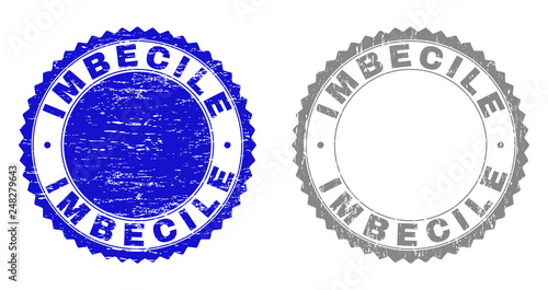 Grunge IMBECILE stamps isolated on a white background. Rosette seals with grunge texture in blue and gray colors. Vector rubber stamp imitation of IMBECILE caption inside round rosette.
