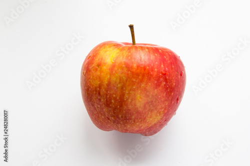 One whole apple fruit at white background