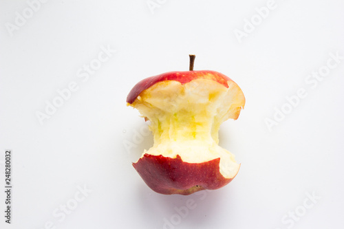 red bitten apple on white background
