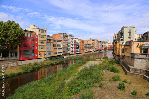 Colorful houses and Eiffel bridge and river Onyar in Girona