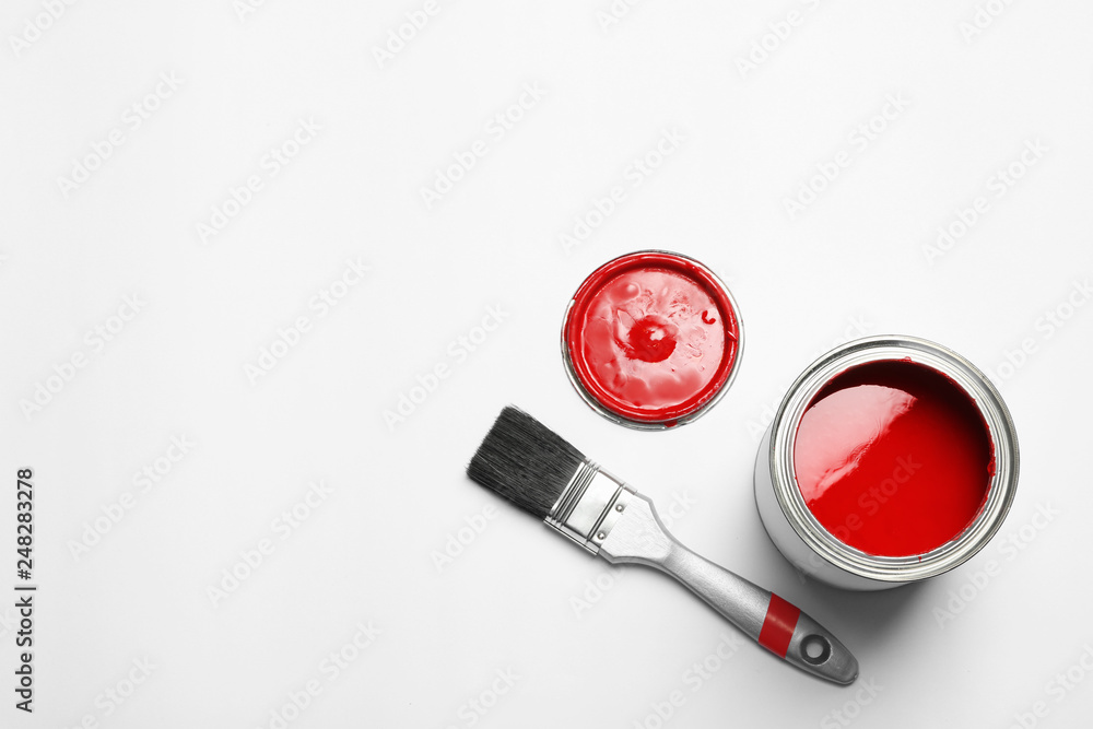 Paint can and brush on white background, top view. Space for text Paint can and brush on white background, top view. Space for text