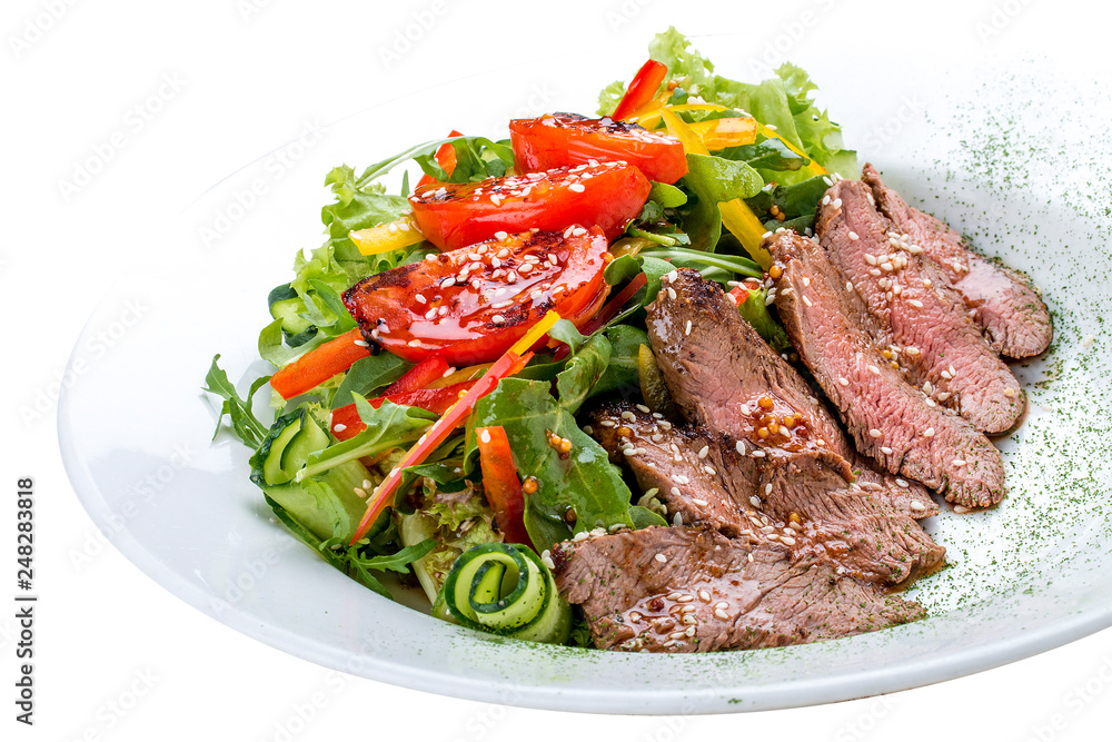 Salad with dried beef and tomatoes on white background Salad with dried beef and tomatoes on white background
