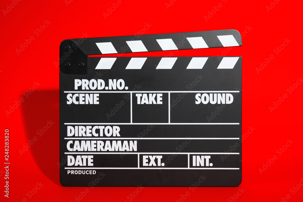 Clapperboard on color background. Modern cinema production