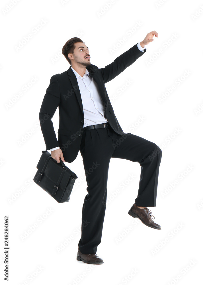 Young businessman attracted to magnet on white background Young businessman attracted to magnet on white background