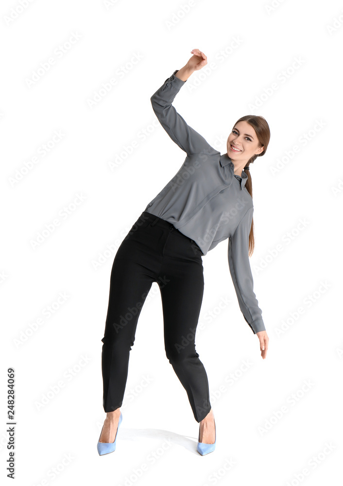 Young woman attracted to magnet on white background