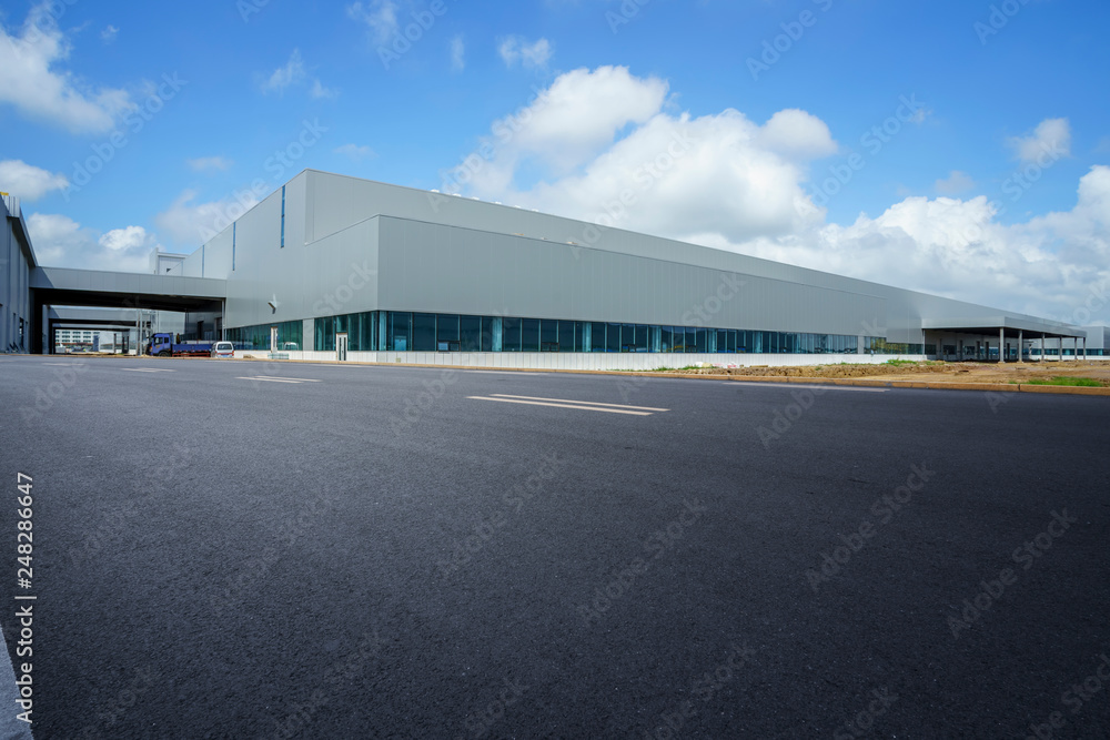Road asphalt pavement and modern factory warehouse.. Road asphalt pavement and modern factory warehouse..