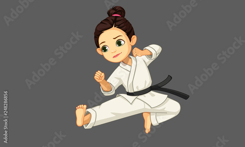 Cute little karate girl in karate pose 2
