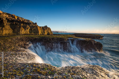 Wide angle landscape image of the dramatic sandstone rock formations along the coastline of Arniston in th Western Cape of South Africa.