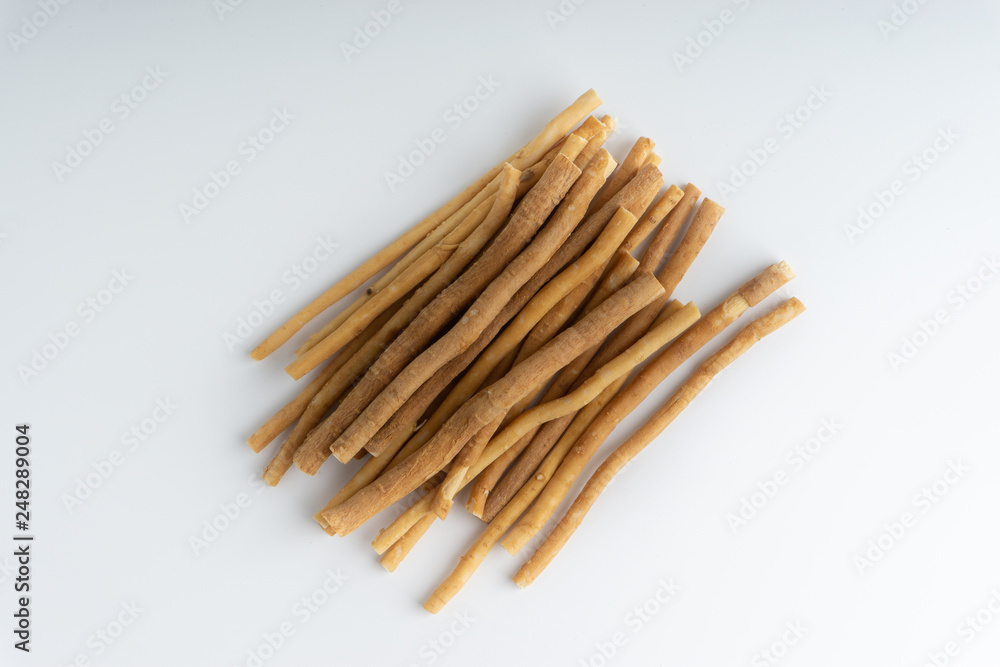 Natural toothbrush Miswak (Kayu Sugi) on white background with selective focus. It is a teeth cleaning twig made from the Salvadora persica tree and also know as miswaak, siwak, Sugi or sewak Natural toothbrush Miswak (Kayu Sugi) on white background with selective focus. It is a teeth cleaning twig made from the Salvadora persica tree and also know as miswaak, siwak, Sugi or sewak