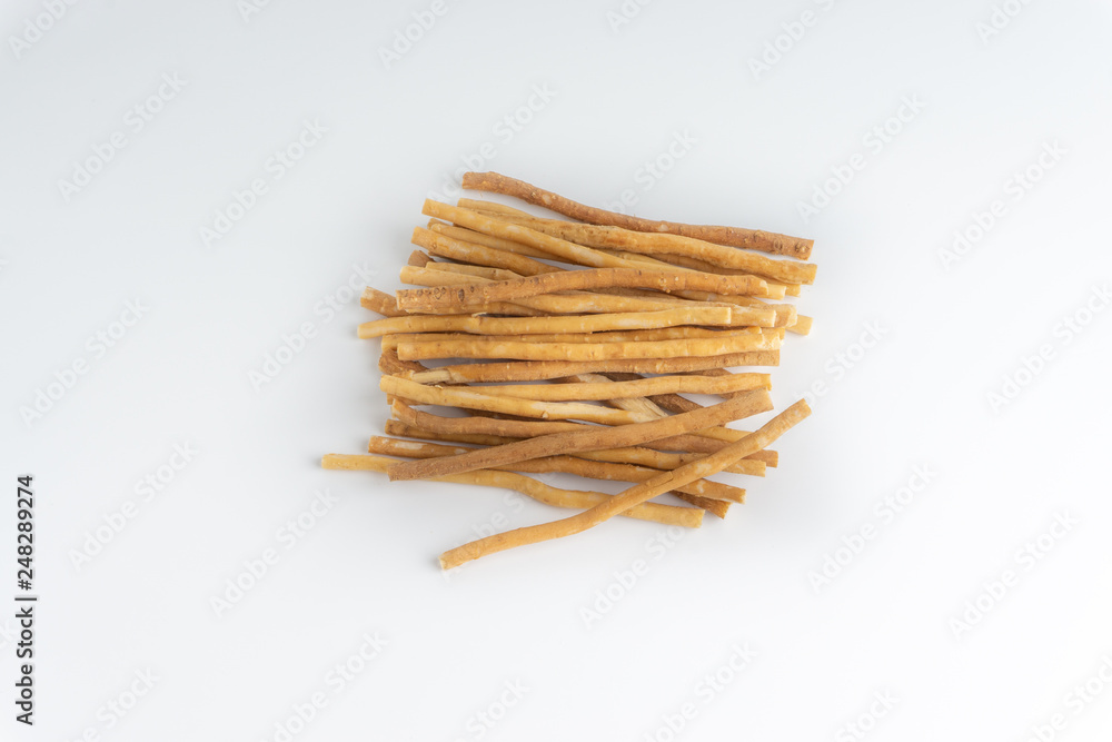 Natural toothbrush Miswak (Kayu Sugi) on white background with selective focus. It is a teeth cleaning twig made from the Salvadora persica tree and also know as miswaak, siwak, Sugi or sewak Natural toothbrush Miswak (Kayu Sugi) on white background with selective focus. It is a teeth cleaning twig made from the Salvadora persica tree and also know as miswaak, siwak, Sugi or sewak