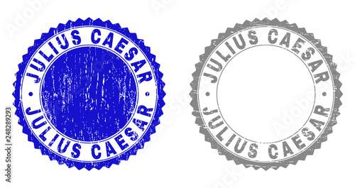 Grunge JULIUS CAESAR stamp seals isolated on a white background. Rosette seals with grunge texture in blue and grey colors. Vector rubber stamp imitation of JULIUS CAESAR text inside round rosette.