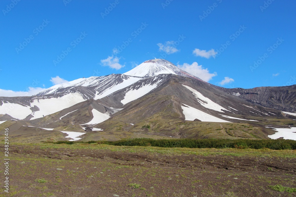 Fototapeta premium View of Avachinsky volcano. Avachinsky (also known as Avacha or Avacha Volcano or Avachinskaya Sopka) is an active stratovolcano on the Kamchatka Peninsula in the far east of Russia.
