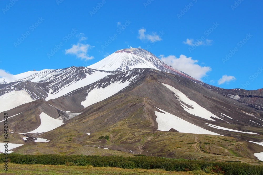 View of Avachinsky volcano. Avachinsky (also known as Avacha or Avacha Volcano or Avachinskaya Sopka) is an active stratovolcano on the Kamchatka Peninsula in the far east of Russia. View of Avachinsky volcano. Avachinsky (also known as Avacha or Avacha Volcano or Avachinskaya Sopka) is an active stratovolcano on the Kamchatka Peninsula in the far east of Russia.