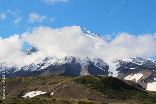 View of the Koryaksky volcano on a sunny day. Koryaksky or Koryakskaya Sopka is an active volcano on the Kamchatka Peninsula in the Russian Far East. photo