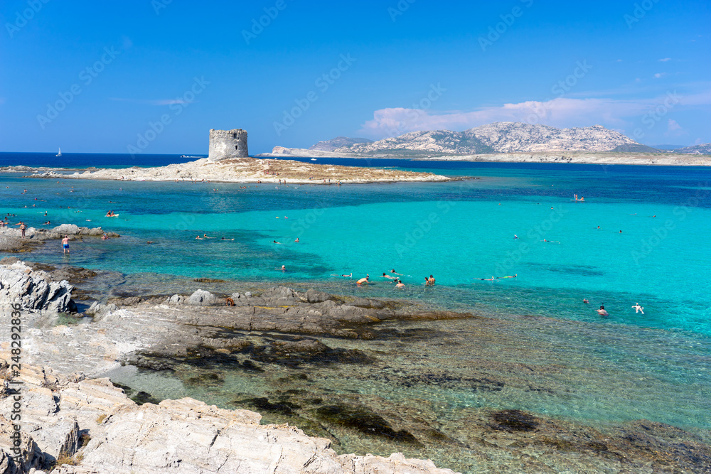 View of Pelosa beach with old Aragonese tower, Sardinia, Italy