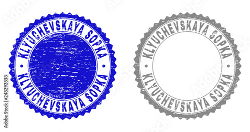 Grunge KLYUCHEVSKAYA SOPKA stamp seals isolated on a white background. Rosette seals with grunge texture in blue and grey colors.