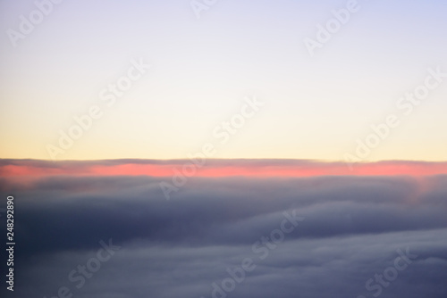 The blue skyline with cloudy in sunrise time, view from window on the plane. © Joeahead