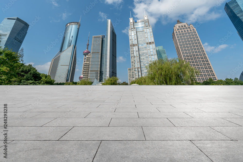 Empty square floor tiles and skyline of modern urban buildings in Shanghai.. Empty square floor tiles and skyline of modern urban buildings in Shanghai..