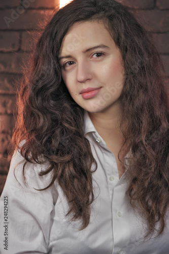 Beautiful attractive girl in a white men's shirt