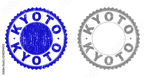 Grunge KYOTO stamp seals isolated on a white background. Rosette seals with grunge texture in blue and gray colors. Vector rubber stamp imitation of KYOTO title inside round rosette.