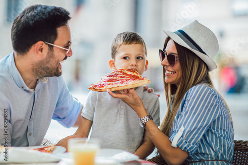 Wallpaper Mural Portrait of happy family spending time in pizzeria Torontodigital.ca