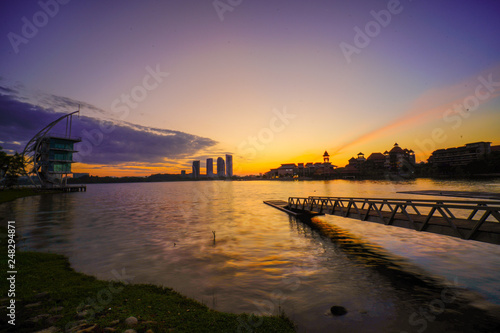 Beautiful Sunrise view at Putrajaya lake with bridge and jetty