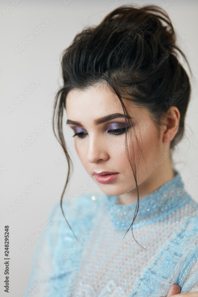modest attractive brunette with beautiful make up, close up portrait.professional makeup for any events, preparation for holiday