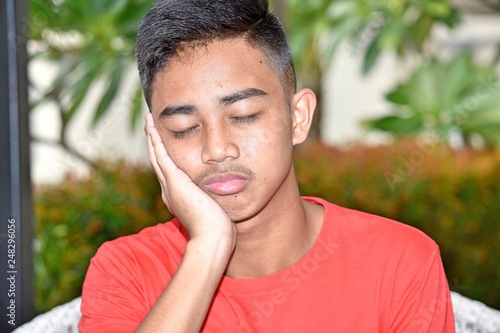 Tired Youthful Asian Person