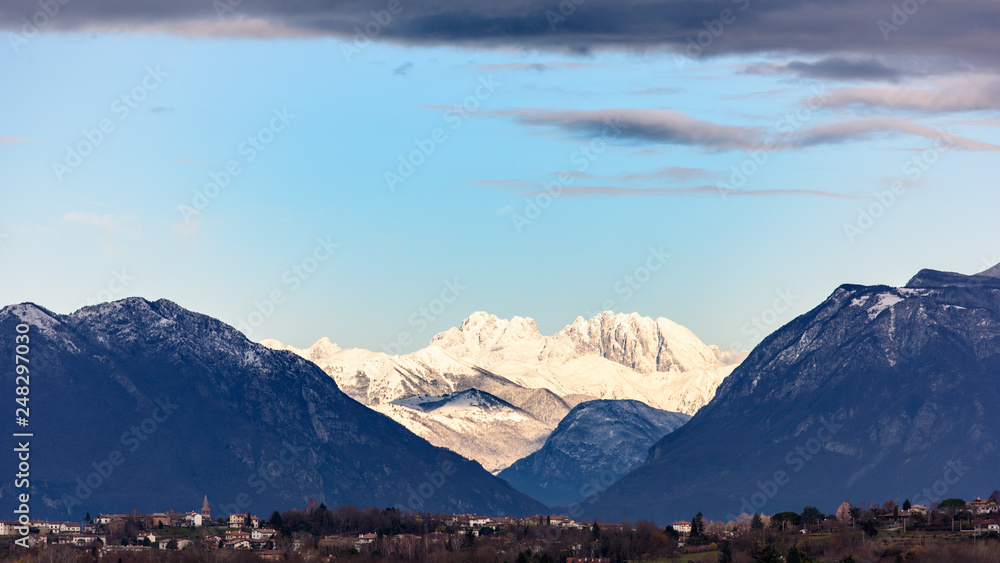 Winter panorama between Cassacco and Tricesimo. From the hills to the snow-capped mountains. Sunrise