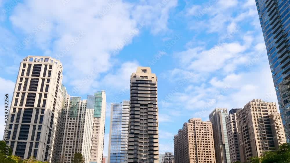 Time lapse cloud movement over modern building Time lapse cloud movement over modern building