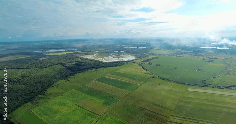 Green fields, factory, quarry. Ukraine, Rivne region, Aerial drone view Green fields, factory, quarry. Ukraine, Rivne region, Aerial drone view