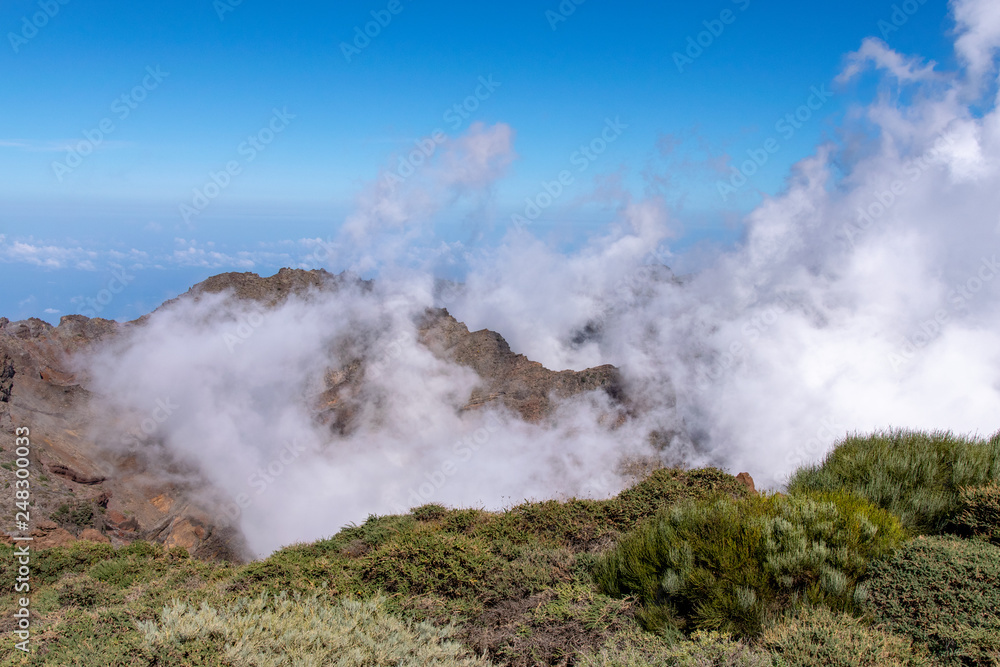 Volcanic rock ledge above the clouds at Roque de Los Muchachos, La Palma Island, Canaries, Spain
