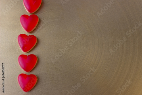 Jelly hearts on the golden metal background. Valentine Day Concept.