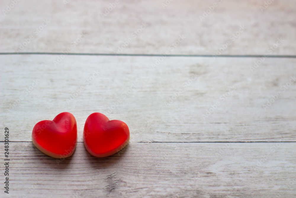 Jelly hearts on the wooden background. Valentine Day Concept.