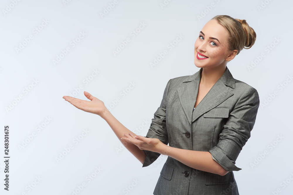 Smiling young businesswoman, showing something, some product or blank copyspace area for advertise slogan or text message, on white background. Smiling young businesswoman, showing something, some product or blank copyspace area for advertise slogan or text message, on white background.
