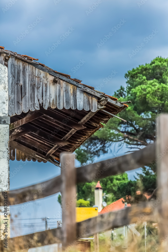 Detailed view of a older extension traditional roof on a abandoned train station building Detailed view of a older extension traditional roof on a abandoned train station building