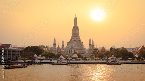 Wat Arun with river at sunset in Bangkok