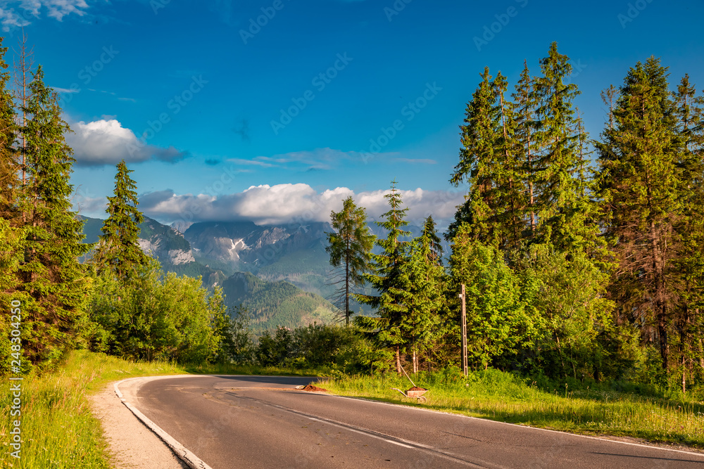 Fototapeta premium Road to Tatra mountains at sunset in Poland