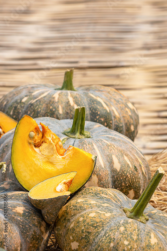 Pumpkin is cut into pieces on the straw.
